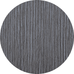 Close-up of a gray, textured Ergo Operative desk surface in a circular frame.
