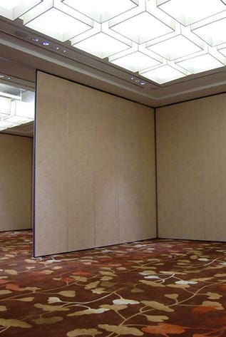 Interior view of movable walls, showing the ceiling, carpet, and wall panels.