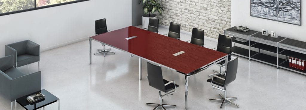 I-Work EVO Conference table with a red desktop and metal frame, surrounded by black office chairs.