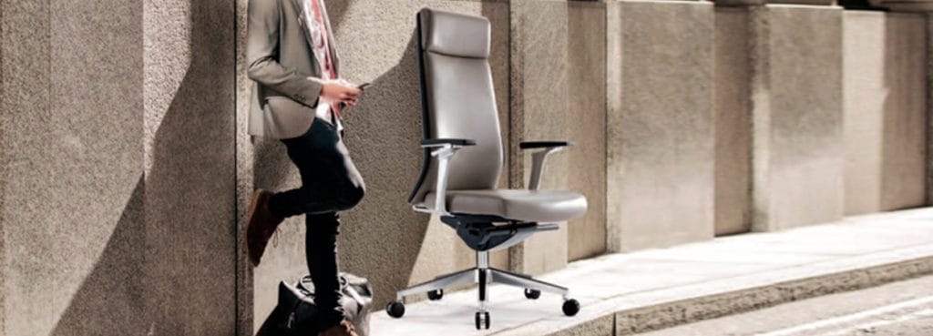Modern gray 536H executive chair with adjustable armrests and rolling base.