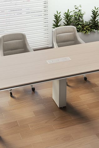 Office table with a Cable Tower, chairs, and plants.