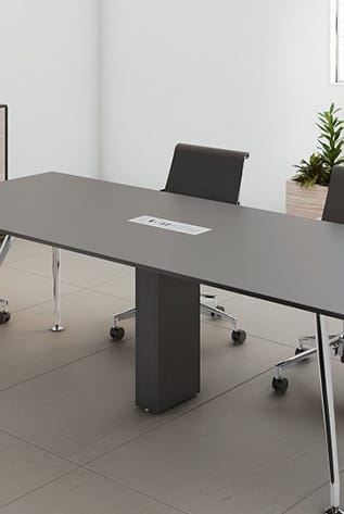 Sleek gray office table with a built-in Cable Tower for organized cable management.