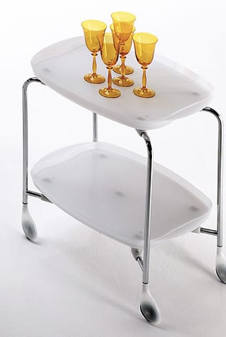 Modern Rexite Desk Sets with white trays and chrome frame. Yellow glasses on top.
