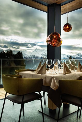 Upscale Restaurants furniture. Modern chairs, set table, and mountain view.