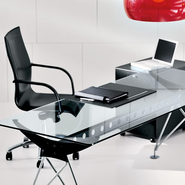 Sleek Consilium desk with glass top, black accents, and modern chair.