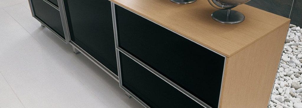 Modern Dedalo Sliding Doors Storage System with sleek black doors, light wood frame, and silver trim.