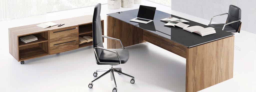Modern EOS executive desk with wood finish, black glass top, and matching chair.