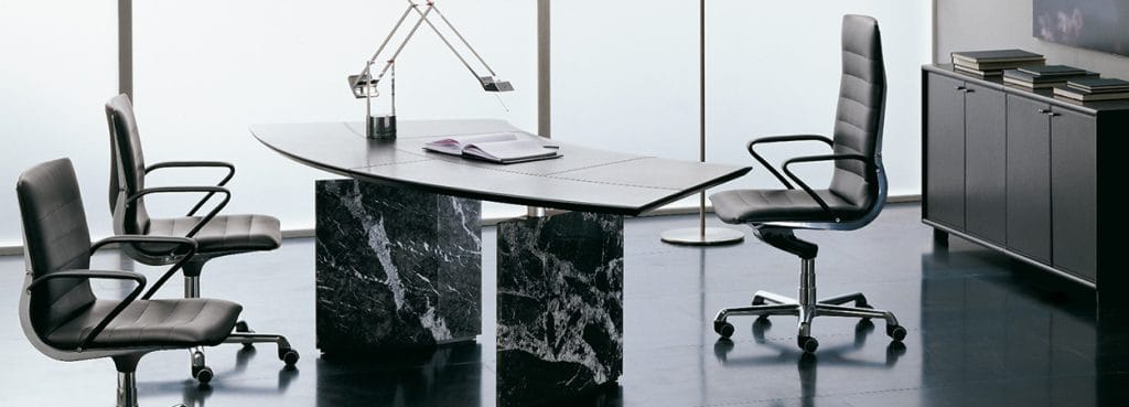Sleek Epico executive desk with marble base and leather top.