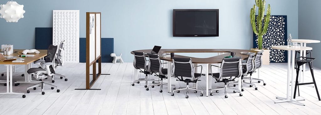 Office space featuring a Herman Miller Everywhere™ Table surrounded by chairs, promoting collaboration.
