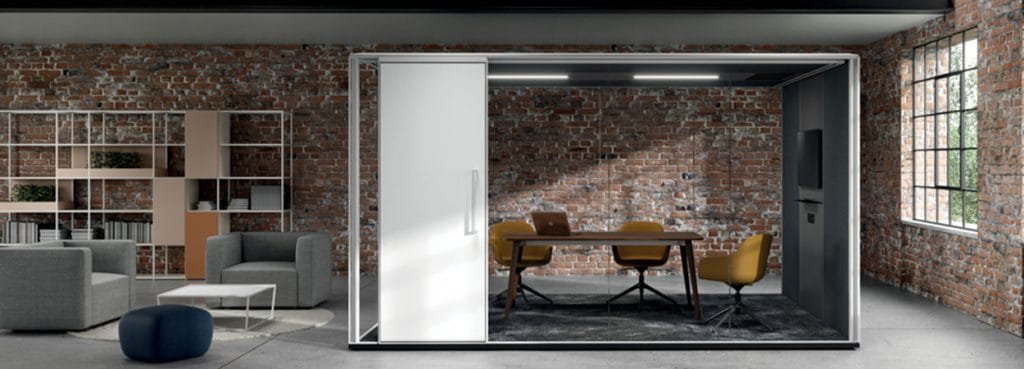 Alea F65 acoustic pod. Modern office booth with wood table and chairs.