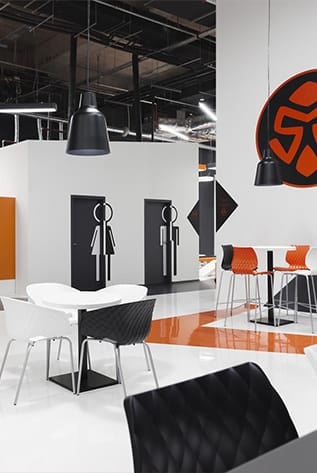 Modern cafeterias with durable furniture. Stylish seating, tables, and lighting for hospitality spaces.