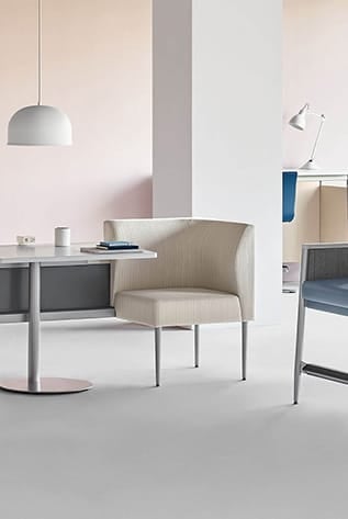 Modern Healthcare Furniture: Beige chair with attached table, clean design. Ideal for waiting areas and patient rooms.
