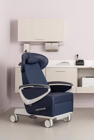 Blue vinyl Healthcare Furniture chair with wheels, designed for comfort and mobility in medical settings.