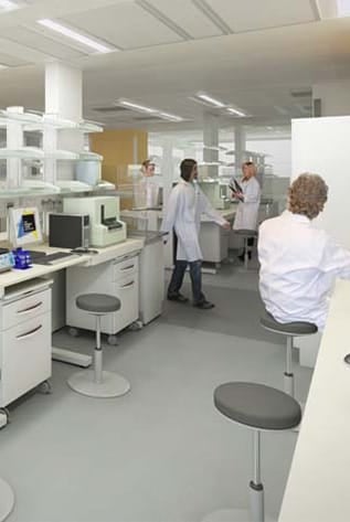 Modern laboratory. White Laboratory Furniture with gray stools and lab workers.