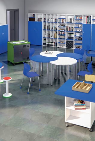 Modern Library Furniture with blue chairs and tables, white shelving, and a green cabinet.