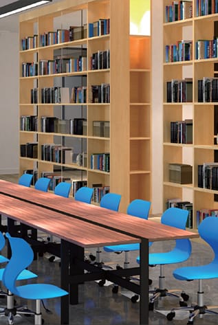 Modern Library Furniture: Wood bookshelves, long table, and blue chairs create a study space.