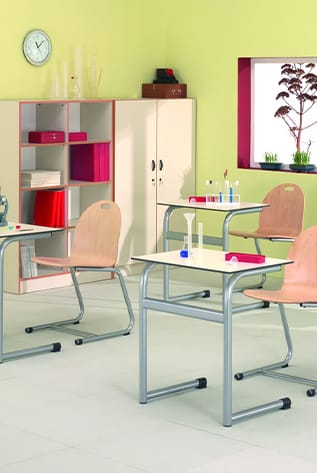 Classroom scene with School Furniture. Desks and chairs with light wood and gray metal frames.