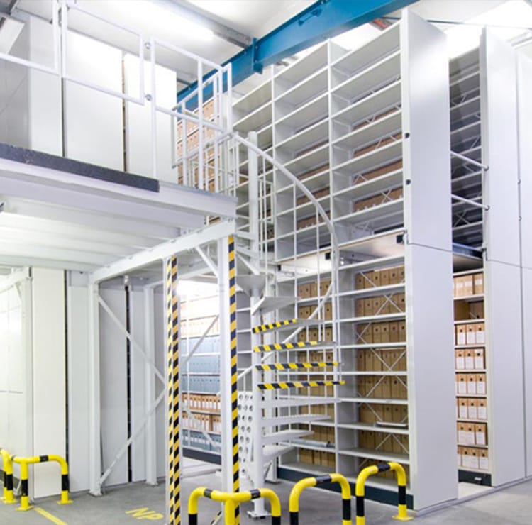 White Mobile Archive Filing Systems with spiral staircase, maximizing storage in any office.