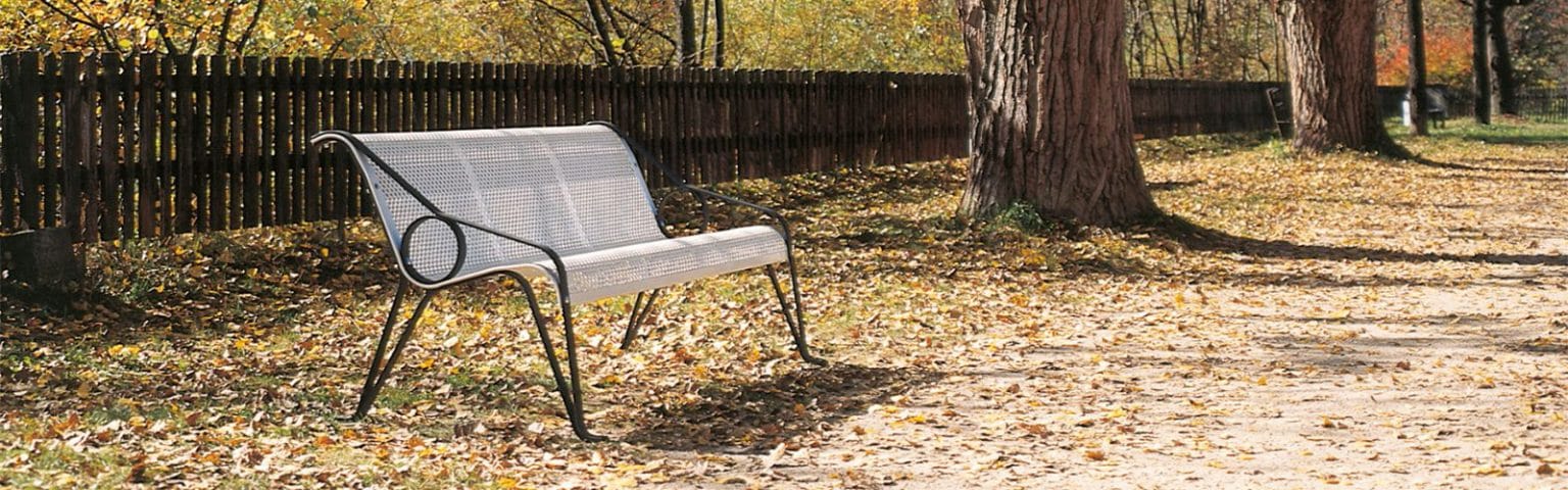 Stylish Street Furniture bench with black frame and silver mesh seat, perfect for urban spaces.
