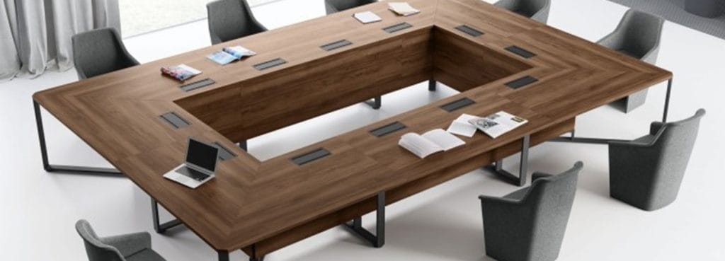 I-Meet Conference Table with a U-shaped wood top, steel legs, and gray chairs.
