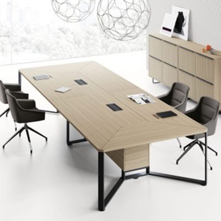 I-Meet Conference Table with light wood top and black steel legs, surrounded by gray office chairs.