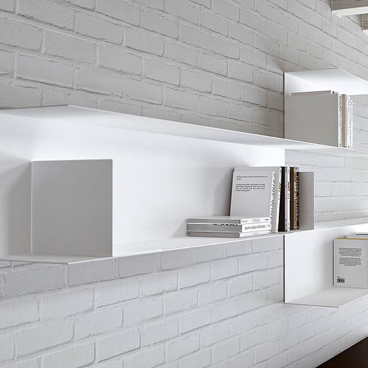 Modern white Icaro Office Cabinet with modular steel shelves against a white brick wall.
