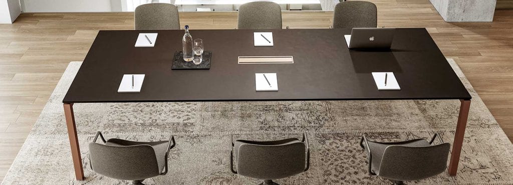Modern Italo_Forty Conference Table with dark top, metal legs, and gray chairs. Ideal for collaboration spaces and meeting rooms.