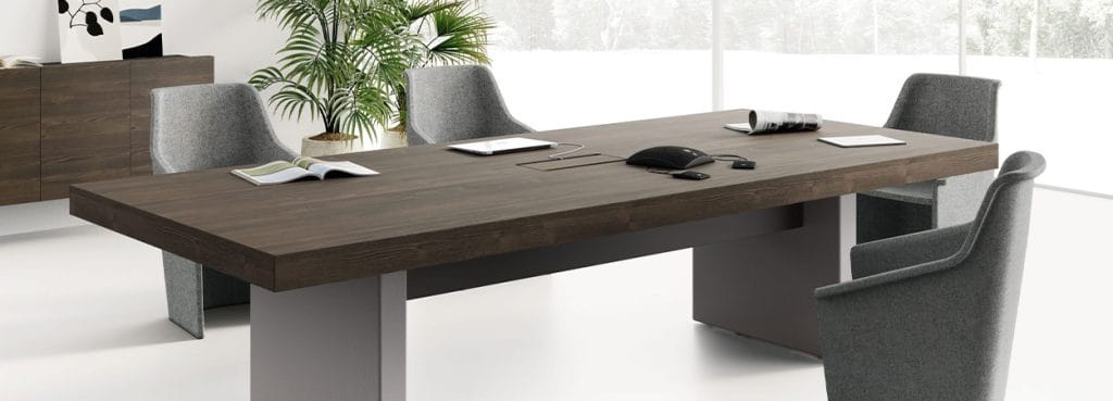 Modern JERA executive desk in wood veneer with gray chairs. Conference table for private offices.