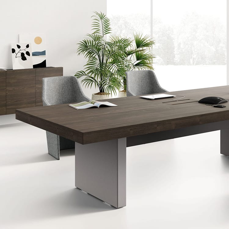 JERA executive desk in wood with gray accents, chairs, and greenery.