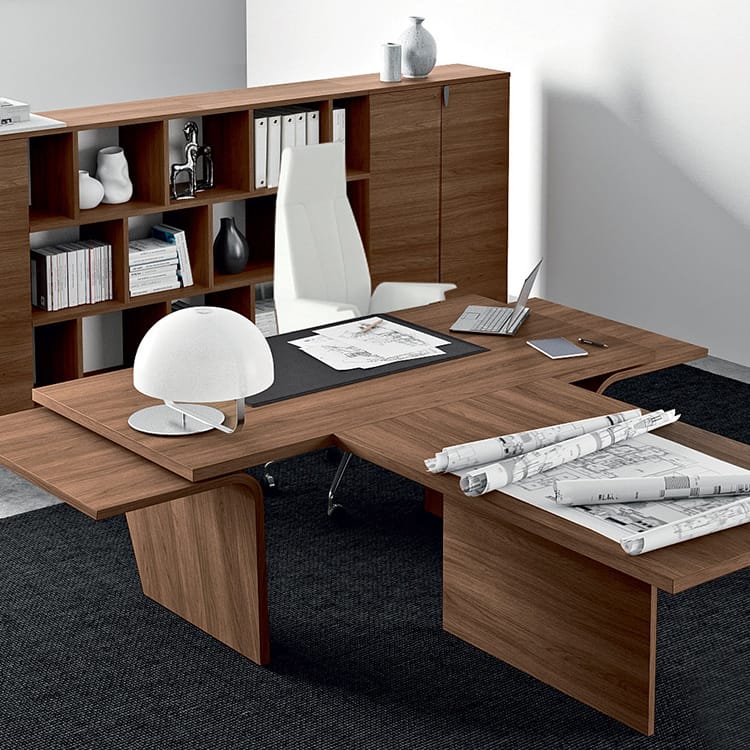 Wood veneer LARUS executive desk with a white chair and shelving in a modern office setting.