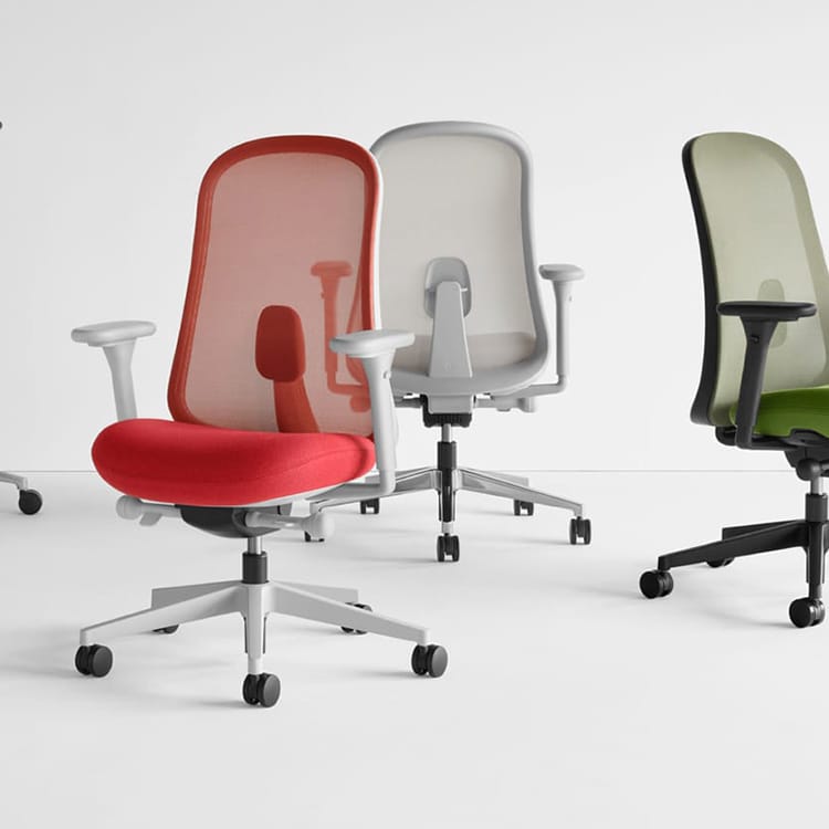 Herman Miller Lino office chair with mesh back, available in red, gray, and green.