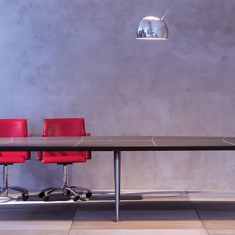 Orazio Conference Table with red chairs, silver legs, and a modern design.