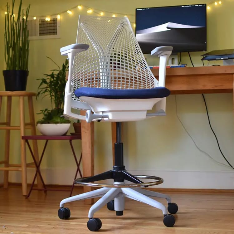 Ergonomic Sayl Stool by Herman Miller with a white frame and blue seat.