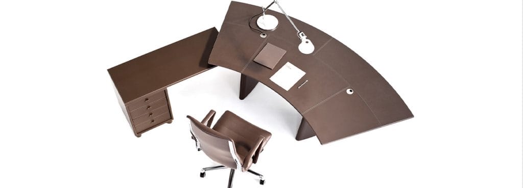 Modern brown leather Pyramid desk with chair, drawers, and lamp. Executive office furniture.