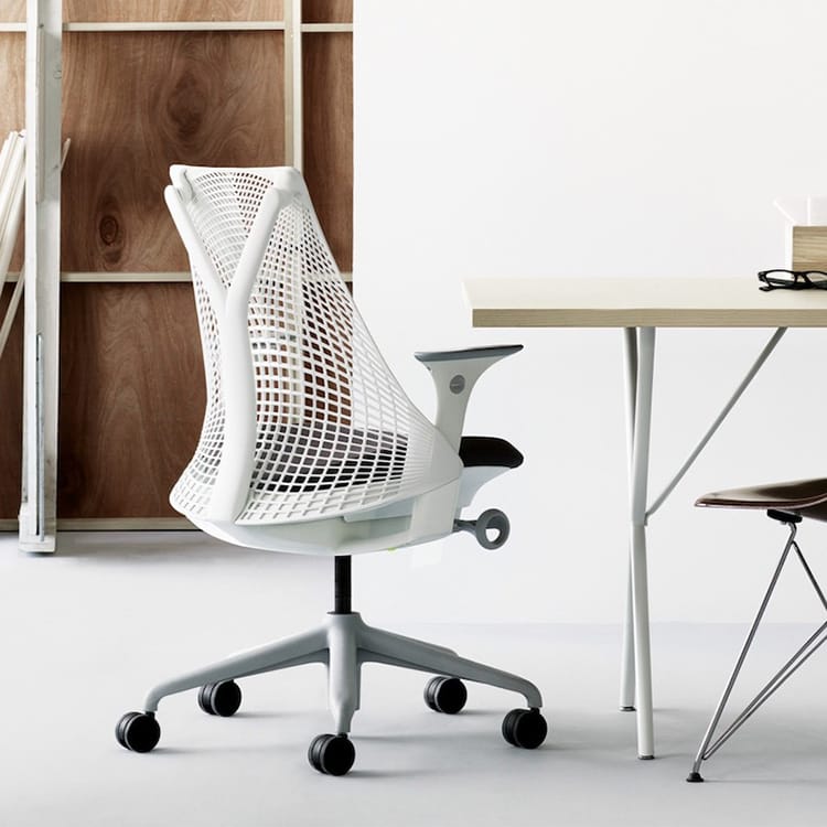 White Sayl chair with a frameless suspension back, offering support and freedom of movement.