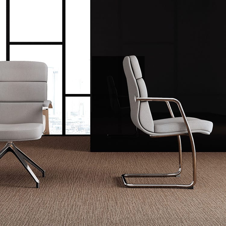 Gray Scena Visitor Chair with metal frame, blending style and comfort for office seating solutions.
