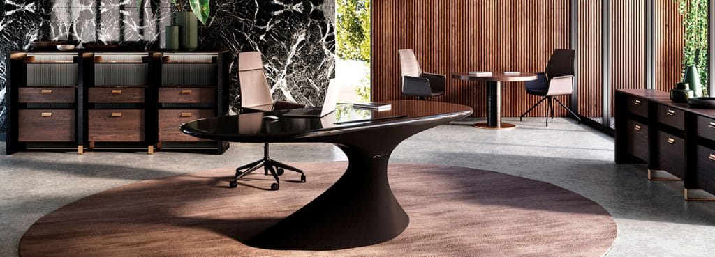 Modern office featuring ZERO desk, sleek black design with a unique curved base.
