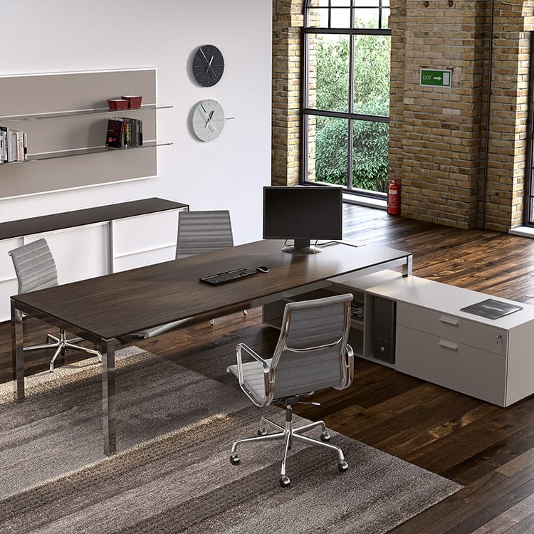 Modern office featuring a dark wood Zefiros desk with gray chairs and white storage.