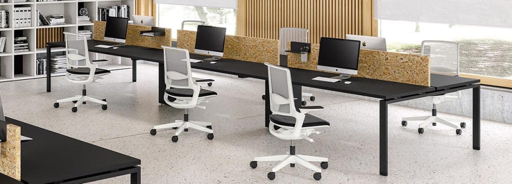 Modern office featuring Atreo desks in black with wood dividers and ergonomic white chairs.