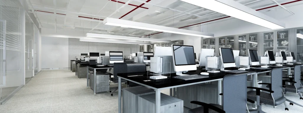 Modern office space featuring sustainable office furniture and computer workstations.