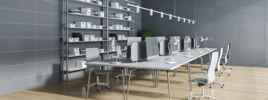 Modern workspace with metal office furniture: desks, chairs and shelving for practical organisation.